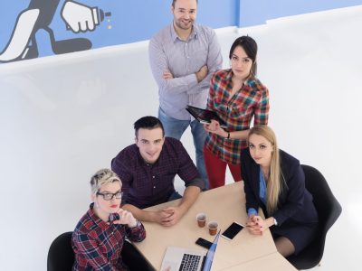 top view of multi ethnic startup business people group on brainstorming meeting in modern bright office interior